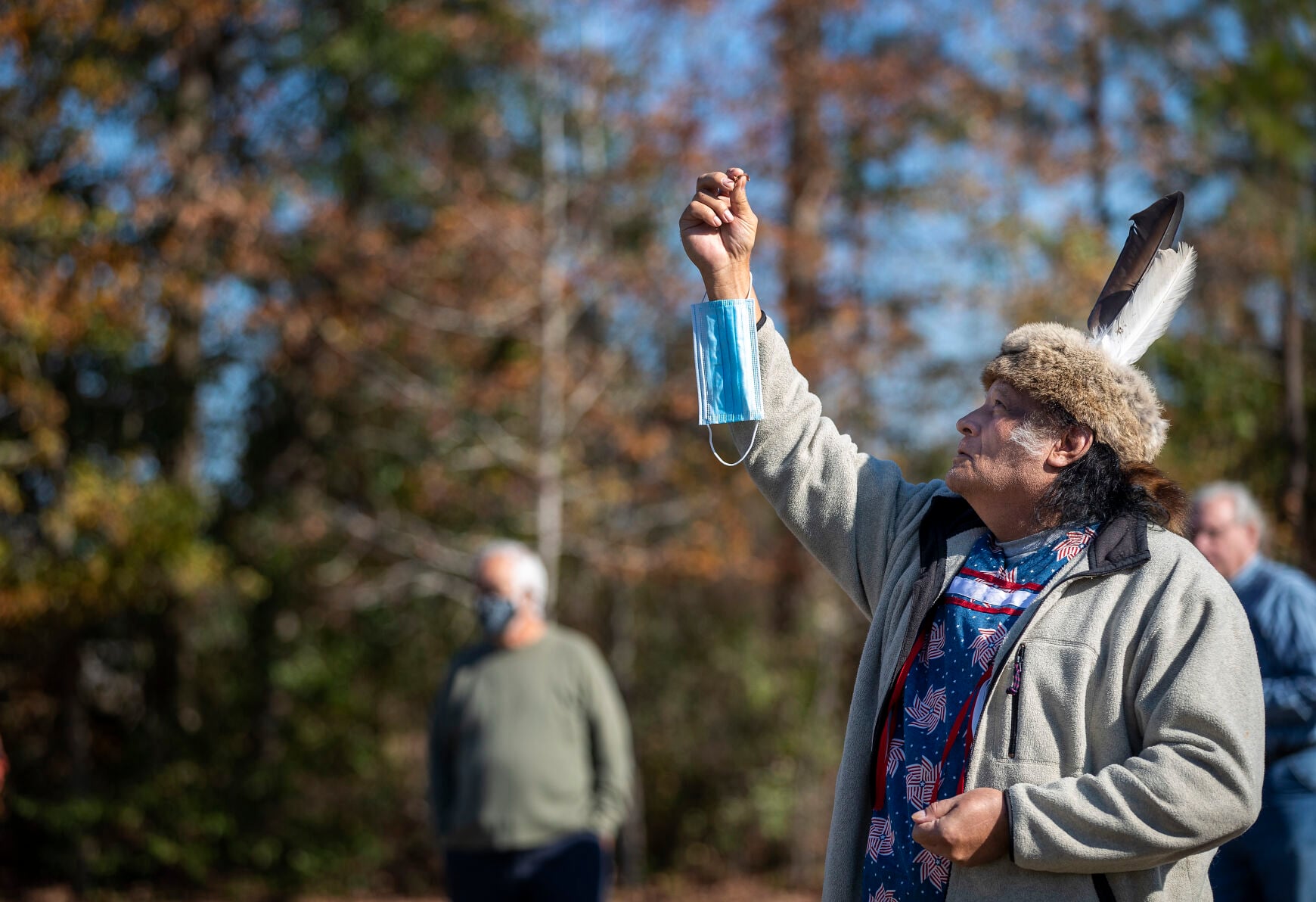 Leading an outdoor gathering in the pandemic year, face paint and mask in hand — the tribe adapted, and met anyway